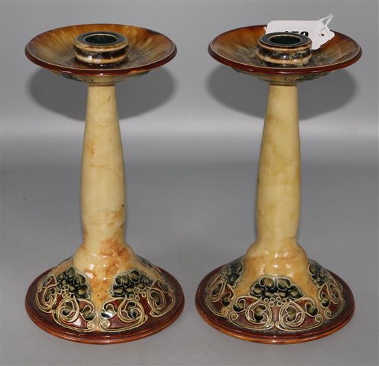 A pair of Doulton Lambeth candlesticks 22cm